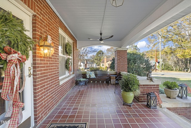 view of patio featuring covered porch and ceiling fan