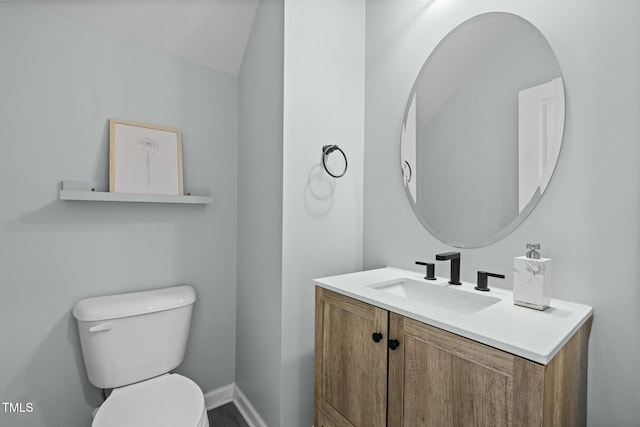 bathroom with toilet and vanity