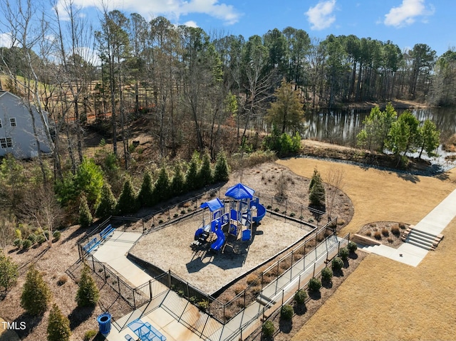 view of yard with a water view and a playground