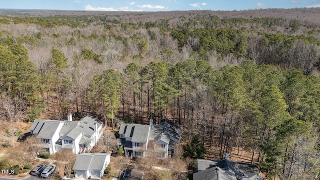 drone / aerial view featuring a forest view