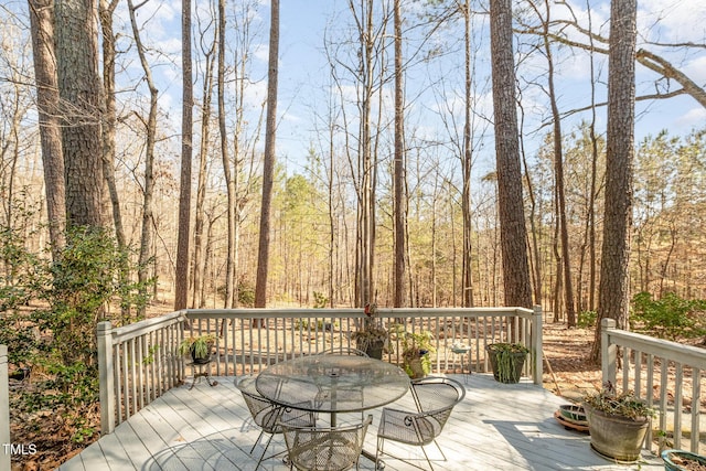 wooden deck with outdoor dining space