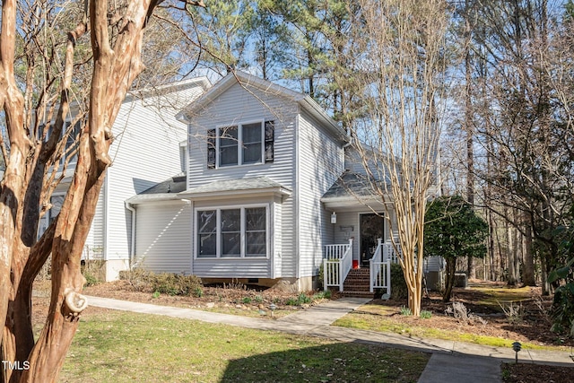 traditional home featuring a porch and crawl space