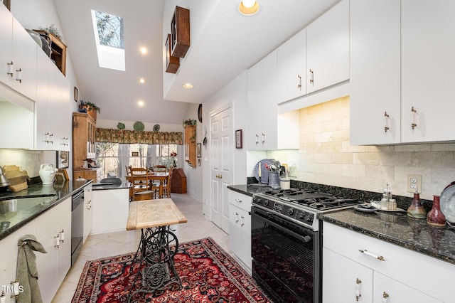 kitchen with gas stove, white cabinetry, light tile patterned flooring, a sink, and stainless steel dishwasher