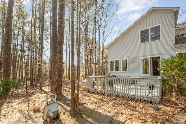 rear view of property with a wooden deck