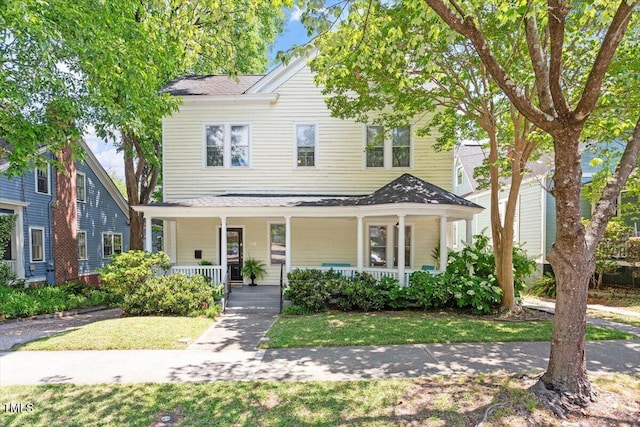 216 N Bloodworth St, Raleigh, NC 27601 - view of front of property featuring a porch, a shingled roof, and a front lawn