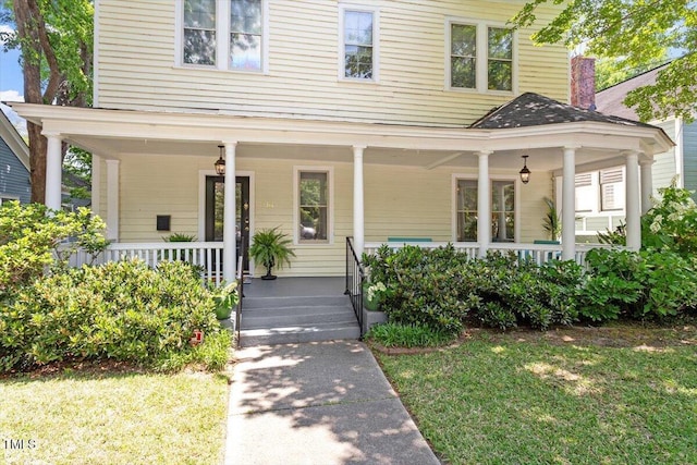 216 N Bloodworth St, Raleigh, NC 27601 - farmhouse with a porch and a front lawn