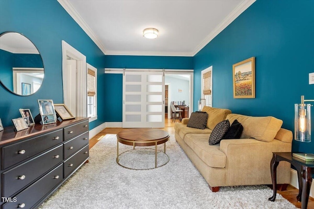 216 N Bloodworth St, Raleigh, NC 27601 - living area with ornamental molding, a barn door, and wood finished floors