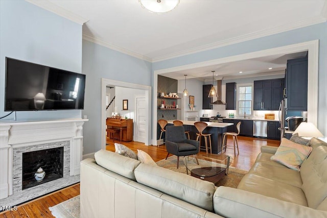 216 N Bloodworth St, Raleigh, NC 27601 - living area featuring stairway, ornamental molding, light wood finished floors, and a premium fireplace