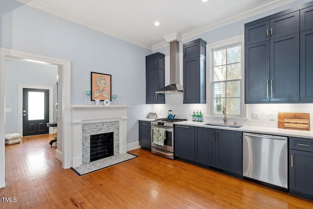 216 N Bloodworth St, Raleigh, NC 27601 - kitchen featuring tasteful backsplash, a sink, light countertops, light wood-style floors, and stainless steel appliances