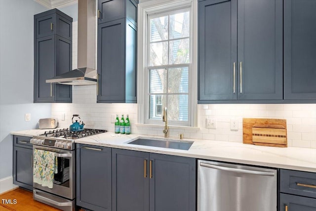 216 N Bloodworth St, Raleigh, NC 27601 - kitchen featuring wall chimney range hood, stainless steel appliances, decorative backsplash, and a sink