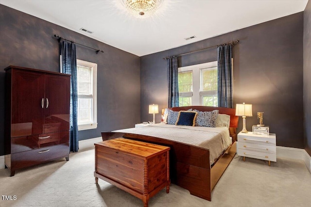 216 N Bloodworth St, Raleigh, NC 27601 - bedroom featuring baseboards, visible vents, and light colored carpet
