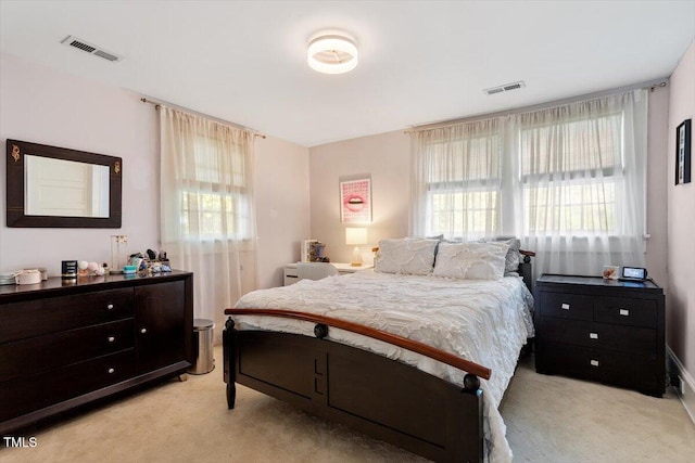 216 N Bloodworth St, Raleigh, NC 27601 - bedroom with visible vents, multiple windows, and light carpet
