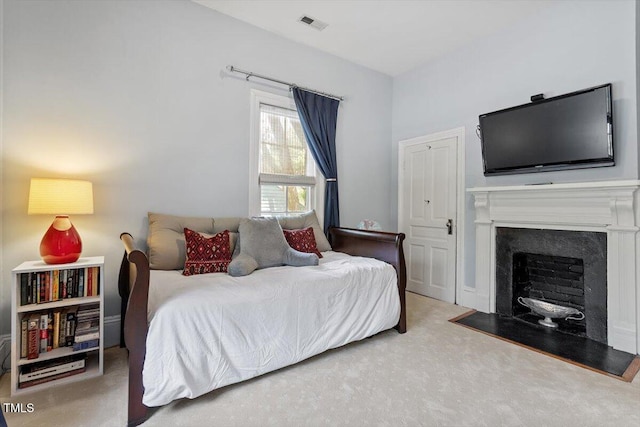 216 N Bloodworth St, Raleigh, NC 27601 - carpeted bedroom with a fireplace and visible vents