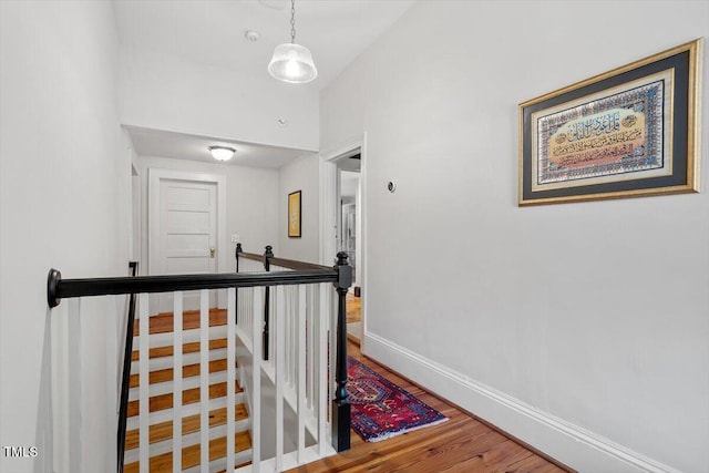 216 N Bloodworth St, Raleigh, NC 27601 - hall with baseboards, an upstairs landing, and wood finished floors