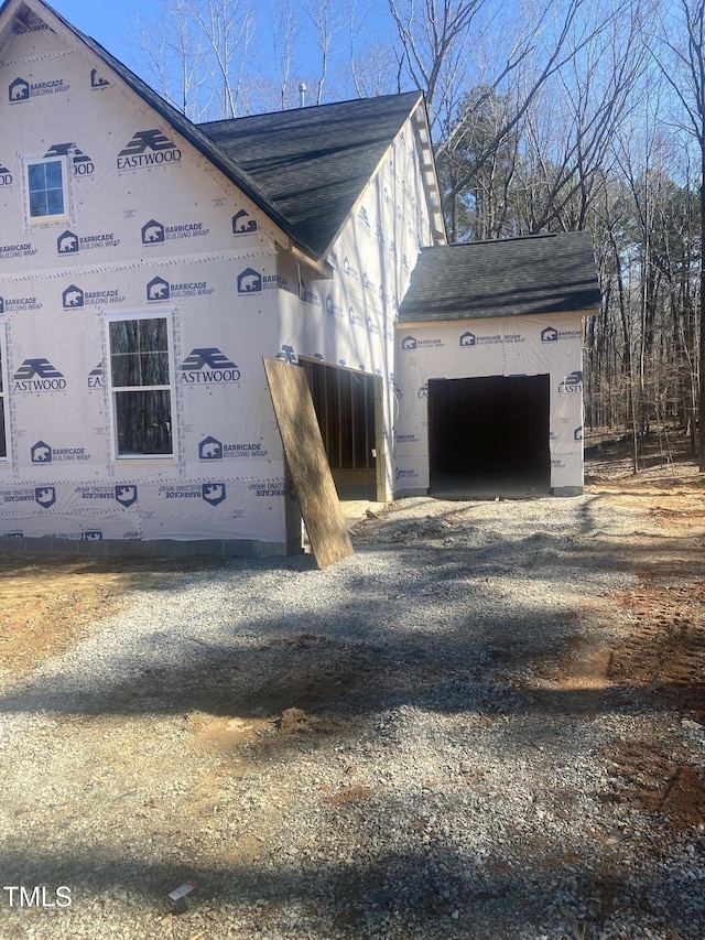 view of side of property featuring a garage