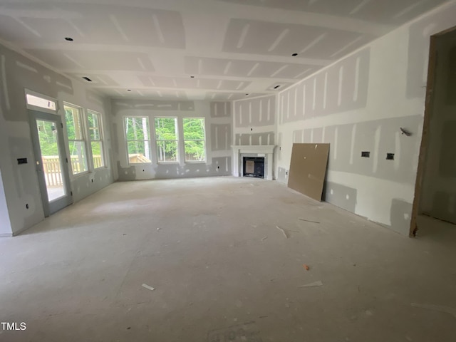 unfurnished living room featuring a fireplace