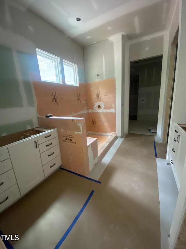bathroom featuring concrete floors