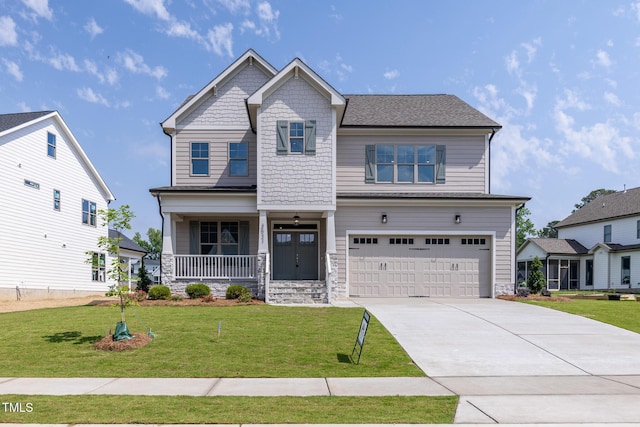 3521 Amelia Grace Dr Lot 67, Fuquay Varina, NC 27526 - craftsman-style house featuring covered porch, a garage, a front yard, driveway, and stone siding