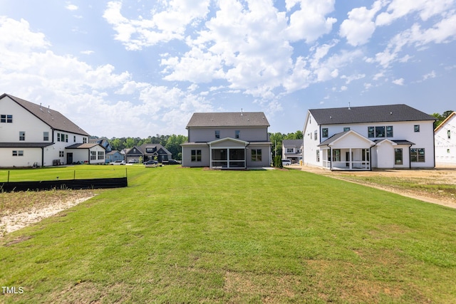 3521 Amelia Grace Dr Lot 67, Fuquay Varina, NC 27526 - rear view of house with a sunroom, a yard, and a residential view