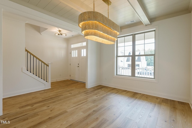 3521 Amelia Grace Dr Lot 67, Fuquay Varina, NC 27526 - foyer entrance with a chandelier, wood finished floors, stairs, baseboards, and wood ceiling with exposed beams