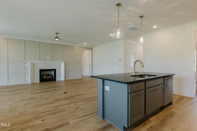 3521 Amelia Grace Dr Lot 67, Fuquay Varina, NC 27526 - kitchen featuring stainless steel dishwasher, dark countertops, a sink, ornamental molding, and a ceiling fan