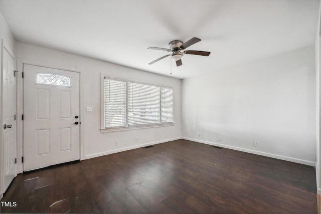 foyer featuring a ceiling fan, baseboards, and wood finished floors