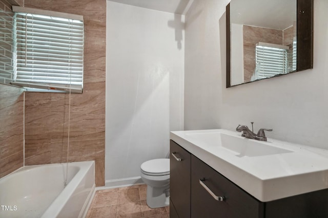 full bathroom with tile patterned floors, vanity, toilet, and baseboards