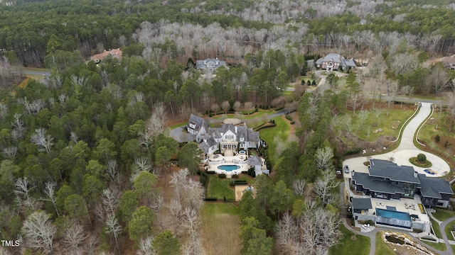 bird's eye view featuring a forest view