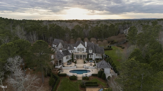 drone / aerial view featuring a view of trees