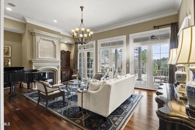 living area featuring a glass covered fireplace, french doors, dark wood-style flooring, and ornamental molding