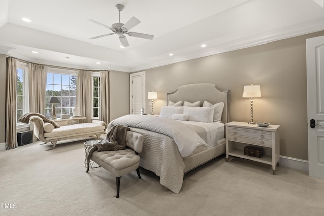 bedroom featuring recessed lighting, a raised ceiling, light colored carpet, and crown molding