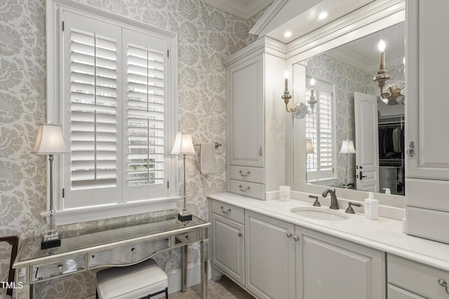 bathroom featuring wallpapered walls, vanity, and ornamental molding