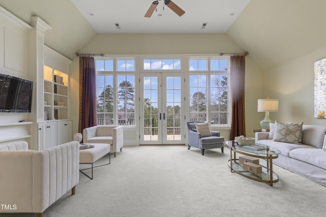 living room featuring visible vents, a ceiling fan, french doors, lofted ceiling, and light colored carpet