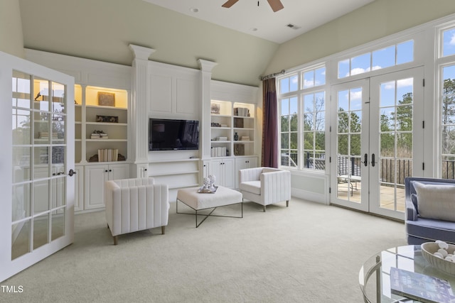 sunroom featuring french doors, visible vents, a ceiling fan, and vaulted ceiling