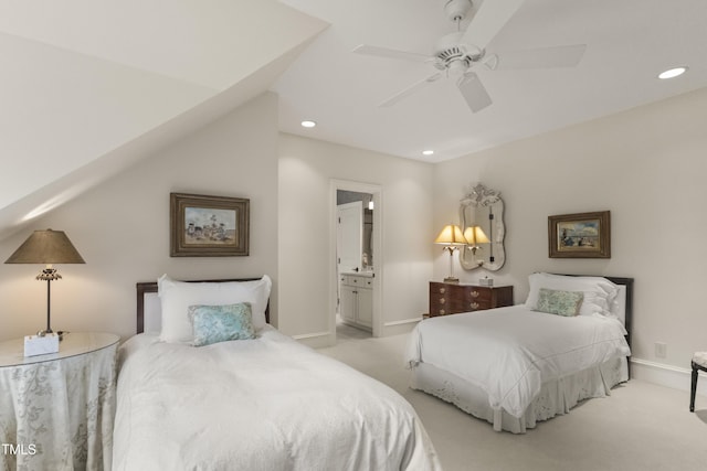 bedroom featuring recessed lighting, connected bathroom, light carpet, and baseboards