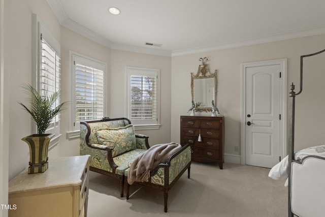 sitting room with visible vents, light carpet, and crown molding