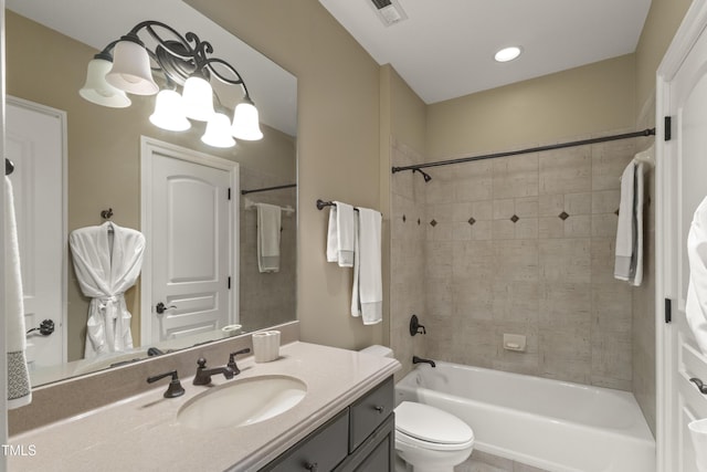 full bathroom with visible vents, toilet, shower / bathtub combination, an inviting chandelier, and vanity