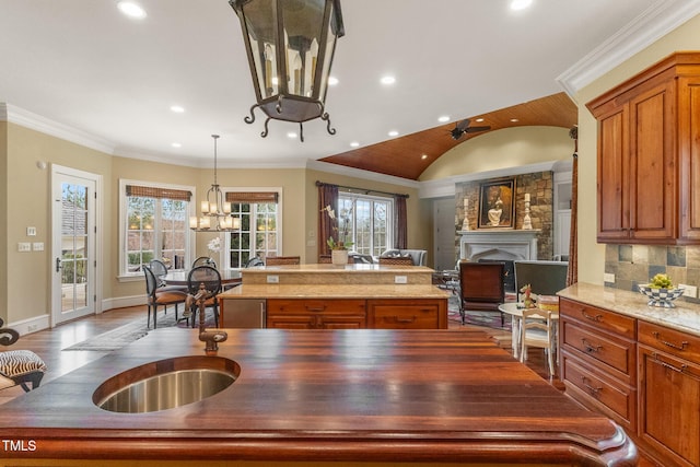 kitchen featuring ornamental molding, plenty of natural light, and a kitchen island