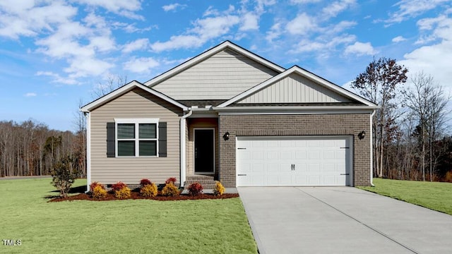 view of front of property featuring a garage, driveway, and a front lawn