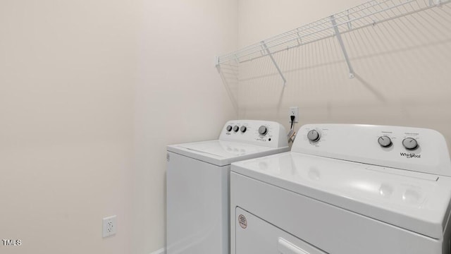 laundry room featuring laundry area and washing machine and clothes dryer