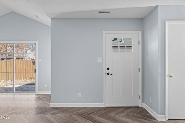 entryway featuring a healthy amount of sunlight, visible vents, and baseboards