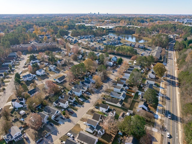 birds eye view of property featuring a water view and a residential view