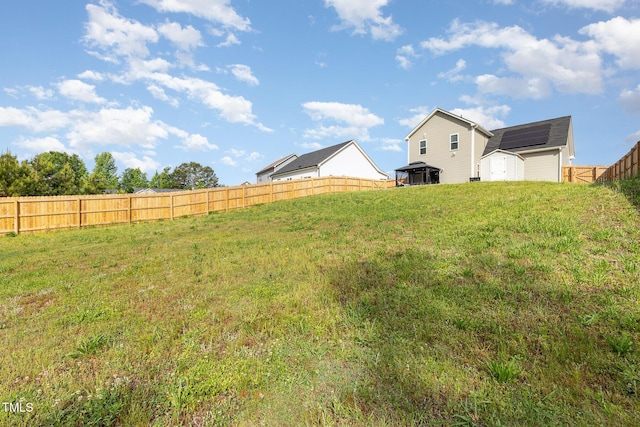 view of yard featuring a shed and an outbuilding