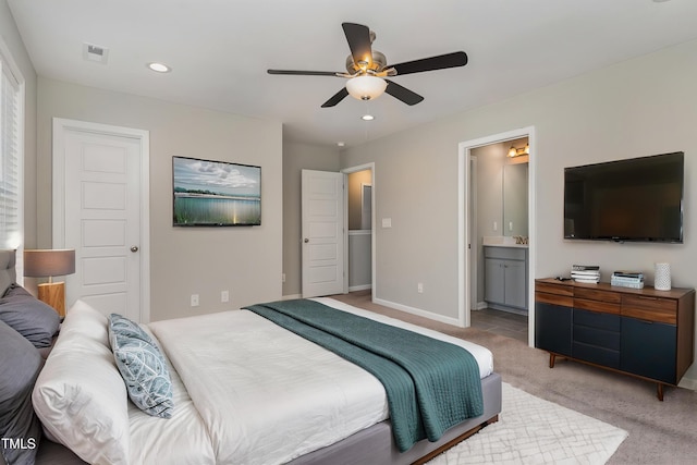 bedroom with light carpet, baseboards, connected bathroom, recessed lighting, and ceiling fan