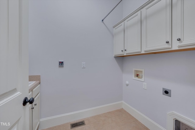 washroom with gas dryer hookup, washer hookup, visible vents, cabinet space, and electric dryer hookup