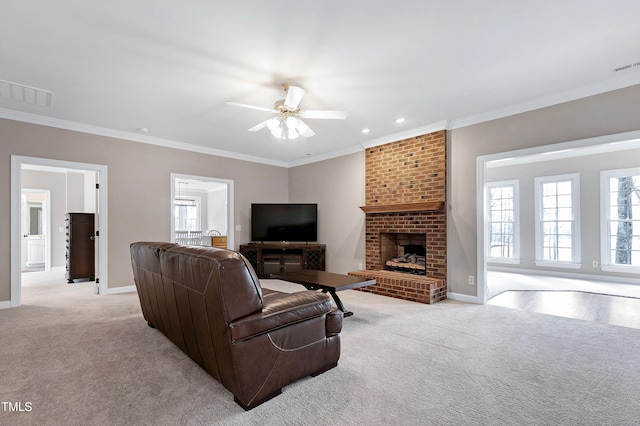 living area featuring visible vents, ornamental molding, a brick fireplace, light carpet, and baseboards