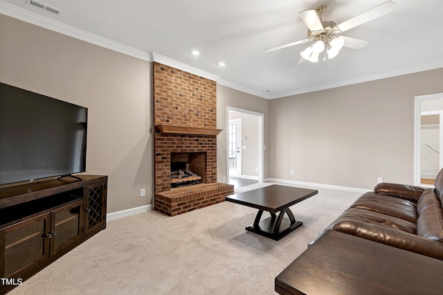 carpeted living room featuring a brick fireplace, baseboards, visible vents, and ornamental molding