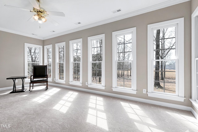 unfurnished sunroom featuring ceiling fan and visible vents