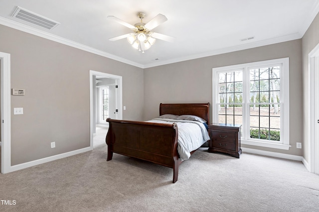 bedroom featuring multiple windows, carpet, visible vents, and crown molding