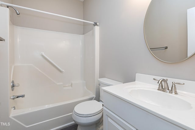 bathroom featuring bathtub / shower combination, vanity, and toilet